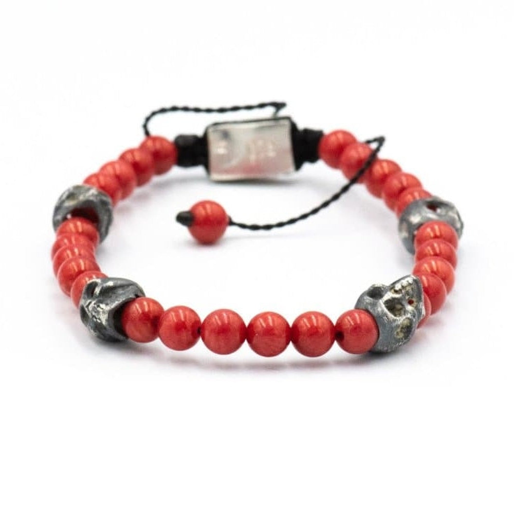 5 SKULLS RED STONE BRACELET